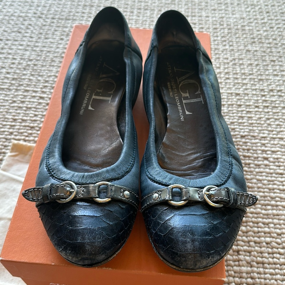 Blue suede and snakeskin flat shoes.